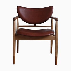 48 Stuhl aus Holz und Leder von Finn Juhl