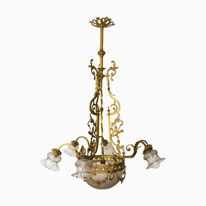 Lámpara de araña estilo Luis XVI de bronce y vidrio con siete luces, años 20