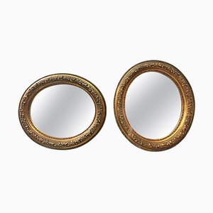 Espejos italianos ovales dorados con pan de oro, década de 1900. Juego de 2