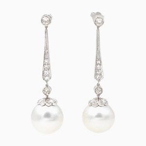 Aretes colgantes de platino con diamantes y perlas