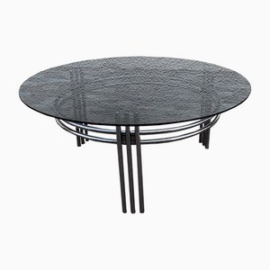 Mesa de centro vintage con estructura de metal cromado y plato redondo de vidrio ahumado, años 70