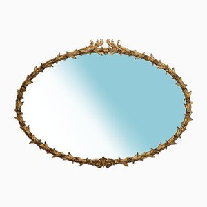 Espejo de pared estilo George III ovalado de madera dorada