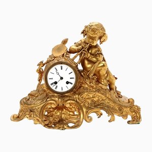 Reloj de repisa de bronce dorado