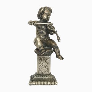 Figura de plata del músico Putti