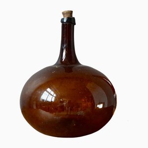 Antike braune mundgeblasene Glasflasche