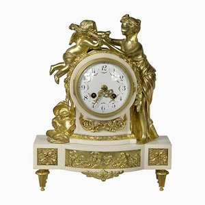 Reloj de repisa francés de bronce dorado y mármol, siglo XIX