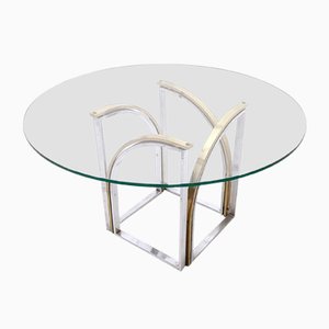 Mesa de comedor posmoderna redonda de latón y acero con tablero de vidrio