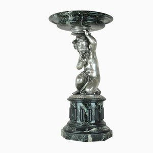 Putto, siglo XIX, mármol y bronce plateado