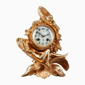 Reloj modernista de bronce dorado, 1900