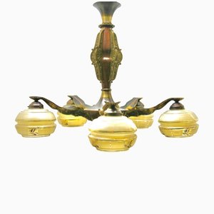 Lámparas de araña Art Déco de latón macizo y detalles de madera con estampado dorado