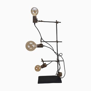 Lámpara de mesa industrial moderna ajustable con tres luces
