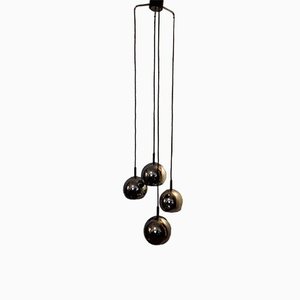 Lámpara en cascada de 4 bolas de metal cromado con soporte de plástico negro, años 70