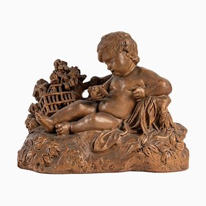 Terracotta Figurine of Child with Bird