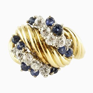 Anillo de zafiro azul, diamante blanco y oro amarillo