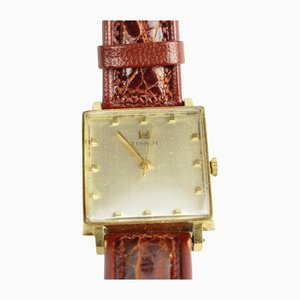 Reloj de oro de 18 quilates con banda Hirsch y caja de Tissot, años 60