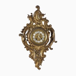 Reloj de pared en bronce dorado