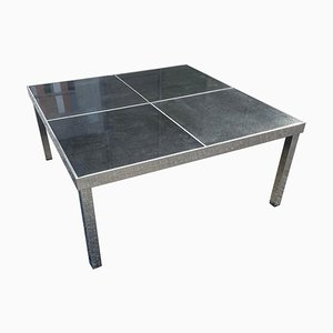 Tavolo in metallo cromato e pietra