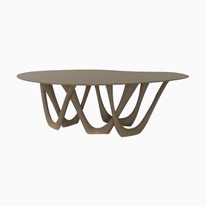 Consola G-Table escultural de acero beige de Zieta