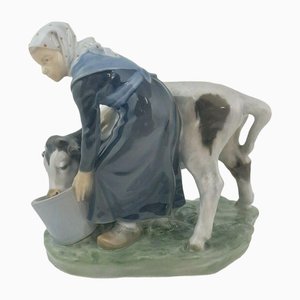 779 - RCH 981 Figurine of Girl Feeding a Calf from Royal Copenhagen