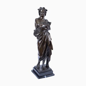 Escultura de bronce de un emperador romano sobre base de mármol, siglo XX