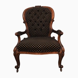 Victorian Walnut Open Armchair with Serpentine Seat on Scroll Supports with Original Brass Castors