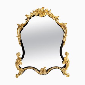 Espejo estilo Luis XV de bronce dorado