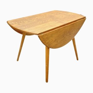 English Round Blonde Drop Leaf Dining Table by Lucian Ercolani for Ercol, 1960s