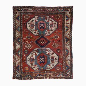 Geometric Kazak Rug in Light Red with a Central Medallion and Border