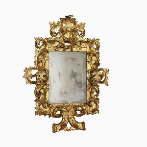 Espejo barroco de madera dorada tallada