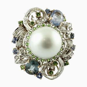 Anello da cocktail con diamante, smeraldo, zaffiro, perla dei mari del sud e oro a 14 carati