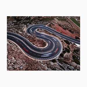 Felix Cesare, A Long Exposure of Vehicles Movement with Blurring and Light-Trails on a Winding Road During the Night, Photographic Paper