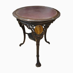 Round Cast Iron Structure Coffee Table With Golden Medallions, Wooden Top & Leather