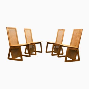 Sillas danesas de madera con asientos y respaldos de caña, años 70. Juego de 4