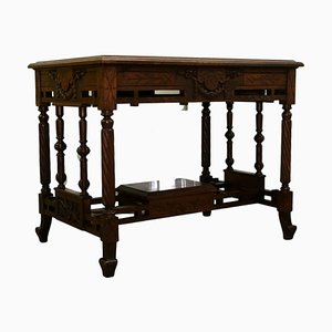 Late 19th Century Continental Carved Walnut Writing Table on Leather Inset Top