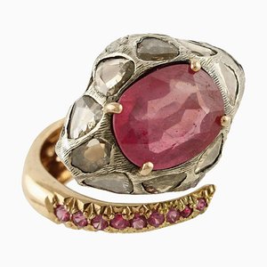 Anillo serpiente en oro rosa y plata con diamantes y rubíes