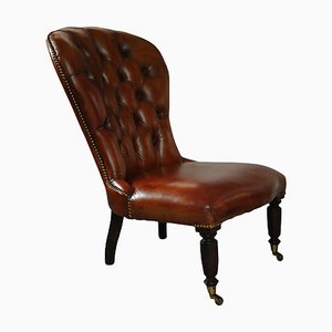 19th Century Polished Tan Leather Chesterfield Library Chair with Brass Stud Detailing on Brass Castors