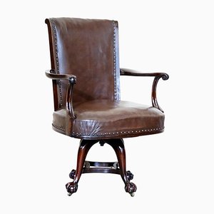Antique Brown Leather Swivel Captains Chair with Claw & Ball Feet from Thomas Chippendale