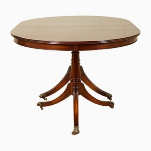 Flamed Mahogany Bradley Extendable Oval Table with Regency Paw Feet Castors