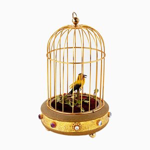 Vogel in einer Käfig-Spieluhr