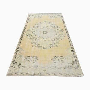 Alfombra turca vintage de lana beige descolorida