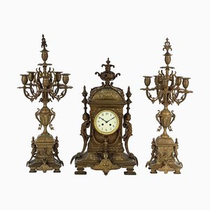 Reloj de bronce con candelabros, siglo XIX. Juego de 3