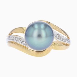 Anillo moderno en oro amarillo de 18 kt con perla de Tahití y diamantes