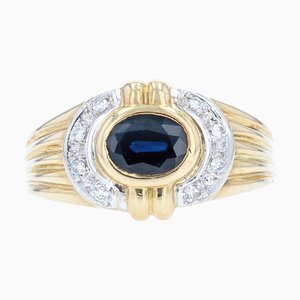 Anillo moderno en oro amarillo de 18 kt con zafiro y diamante