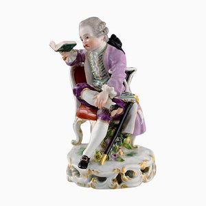 Figura alemana antigua de porcelana pintada a mano, niño noble con libro