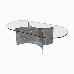 Tavolino da caffè moderno con ripiano ovale in vetro e base in acciaio curvo, Italia, anni '70