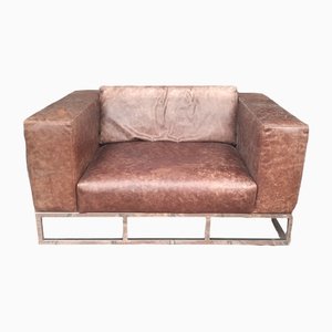 Vintage Leather Sofa With Chrome Metal Base by Andrew Martin London