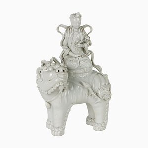 Statuetta Manjushri seduta sul leone