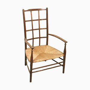 Arts & Crafts Lattice Back Low Armchair with Rush Seat from Liberty & Co