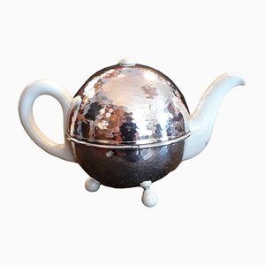 Art Deco German Cream White Porcelain Silver Plated Insulated Metal Coat with Cream White Bakelite Feet Spherical Tea Toan from WMF, 1930s