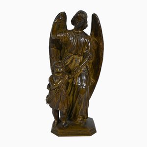 Kind von einem Engel geführt, 1900, Skulptur aus patinierter Bronze